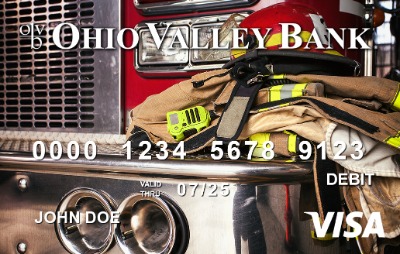 image of firefighter gear atop a red fire engine